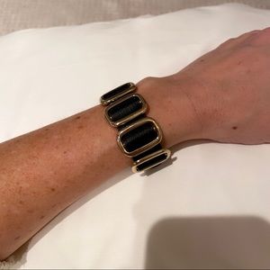 Black leather and gold bracelet